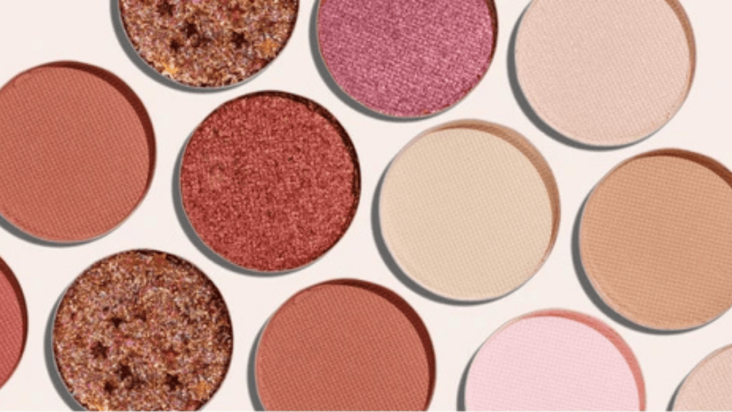 A beautifully arranged palette of glitter eyeshadows with a mix of colors and textures.