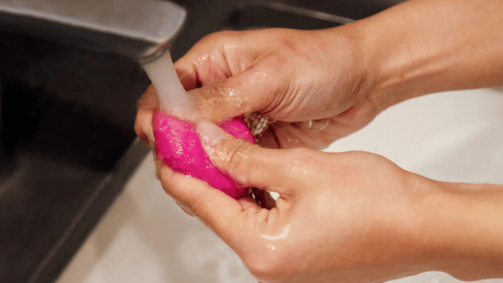Soaking a Makeup Sponge to Clean It