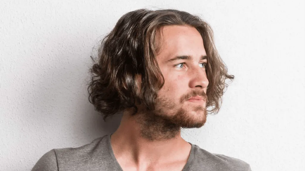 Long hairstyles for men — textured layers and beach waves example